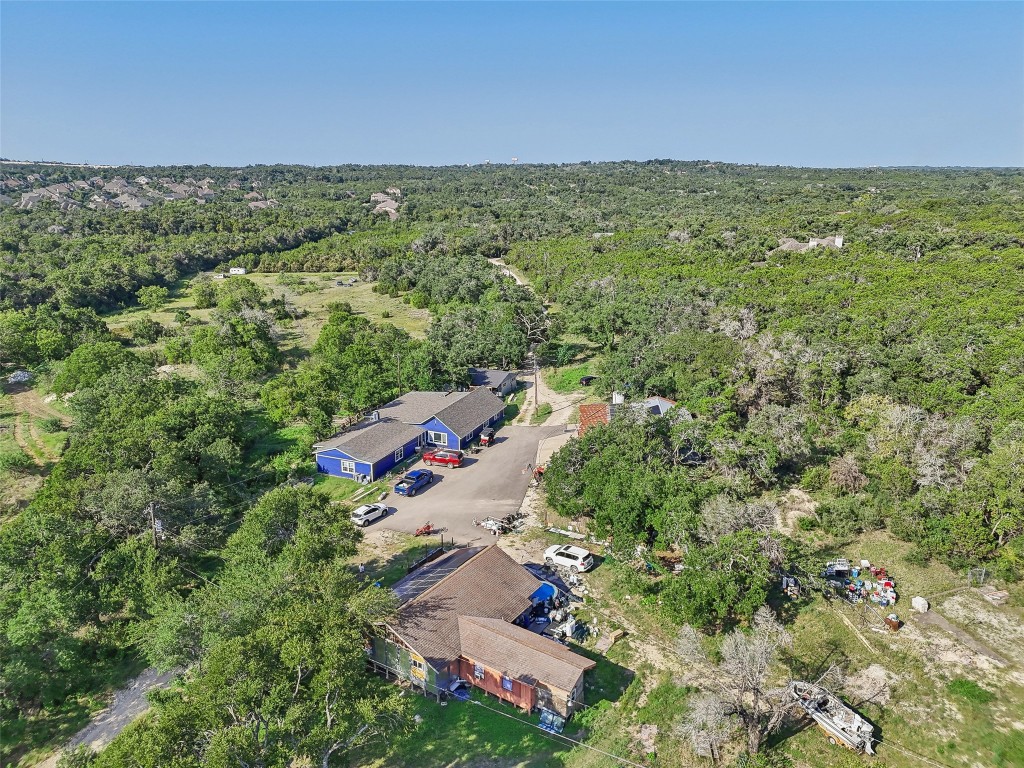 8737 State Highway 71 Austin, TX 78735 - Photo 2 of 13 an aerial view of residential houses with outdoor space and trees