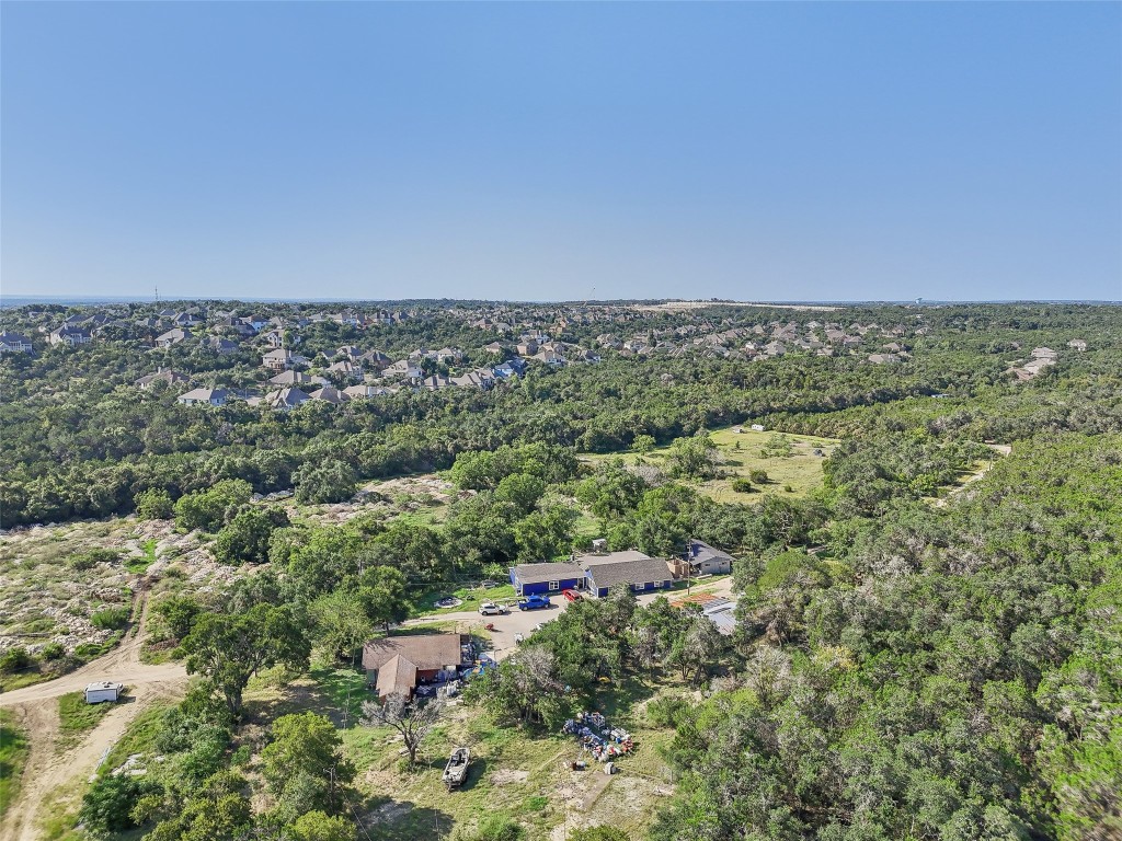 8737 State Highway 71 Austin, TX 78735 - Photo 3 of 13 an aerial view of a forest with houses