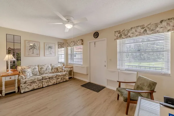 a living room with furniture and a window