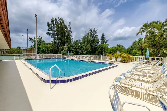 a view of a swimming pool with a patio