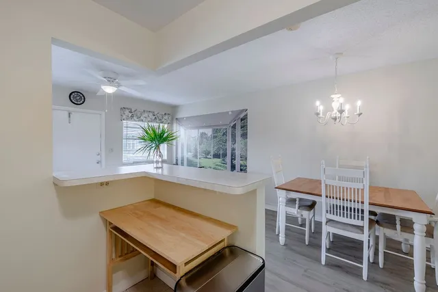 a kitchen with a table and chairs in it