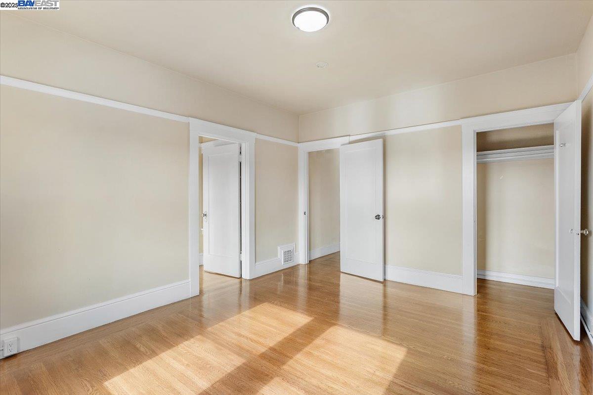 629 Santa Clara Avenue Alameda, CA 94501 - Photo 11 of 47 a view of a room with wooden floor and white walls