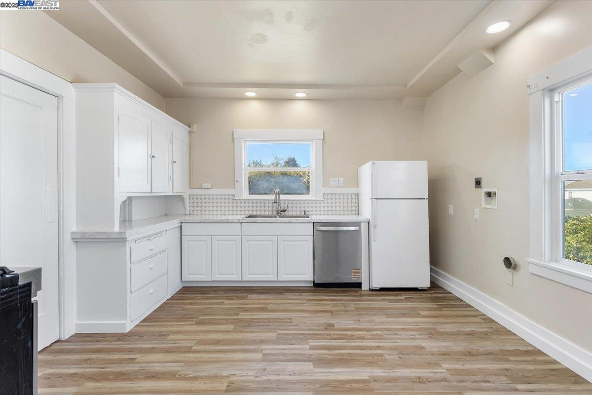 629 Santa Clara Avenue Alameda, CA 94501 - Photo 14 of 47 a kitchen with a refrigerator and white cabinets