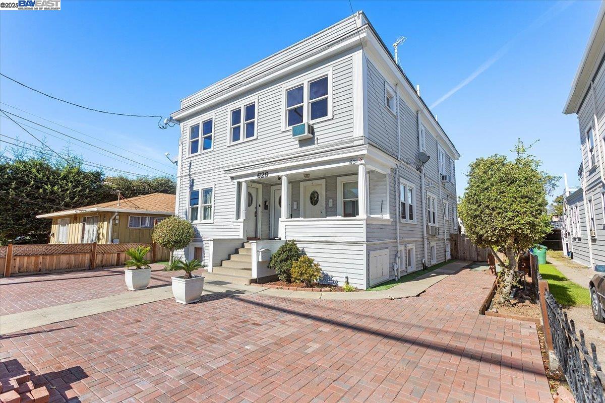 629 Santa Clara Avenue Alameda, CA 94501 - Photo 4 of 47 a front view of a house with a garden and mountain view