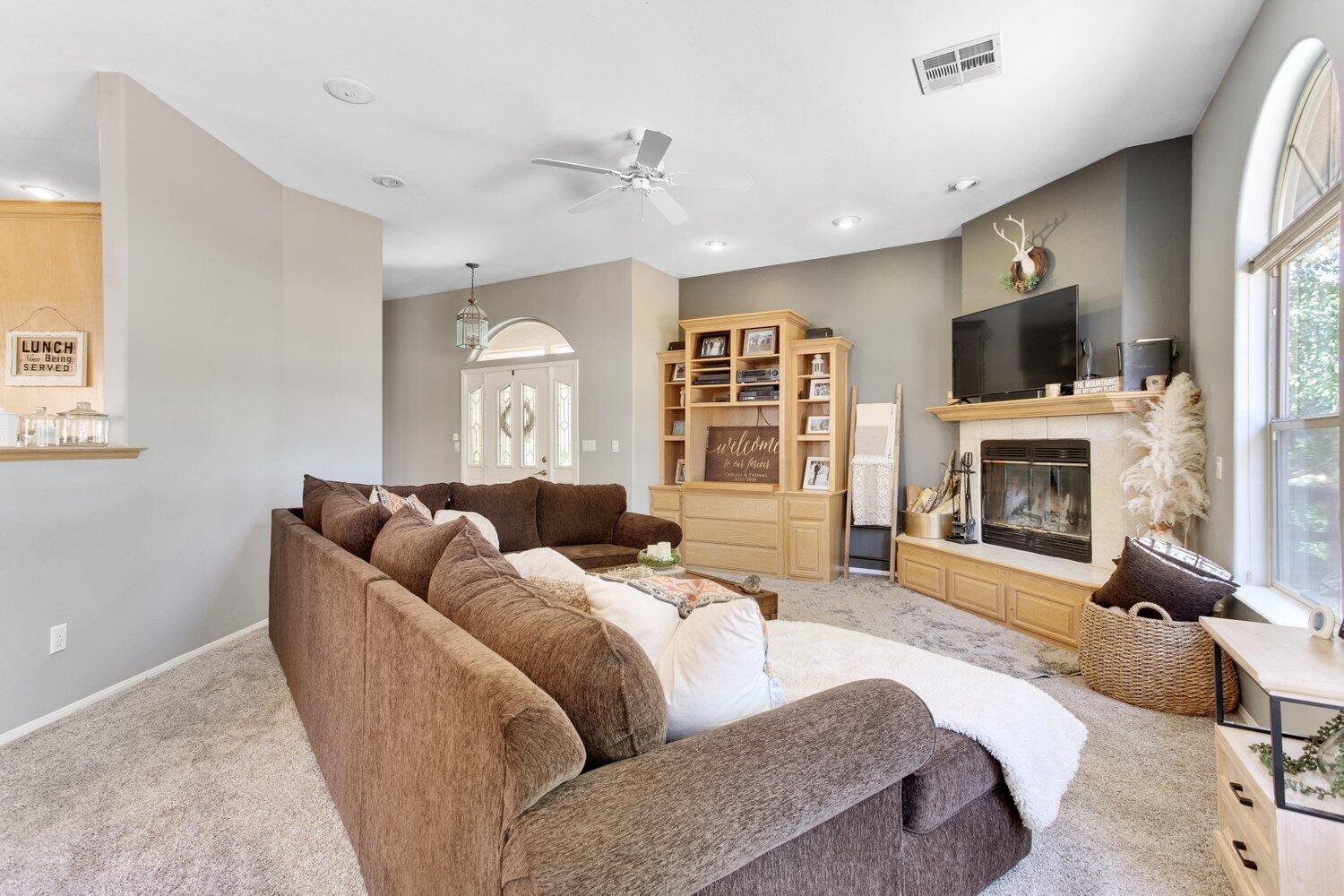 19510 Banducci Road Tehachapi, CA 93561 - Photo 11 of 75 a living room with furniture fireplace and flat screen tv