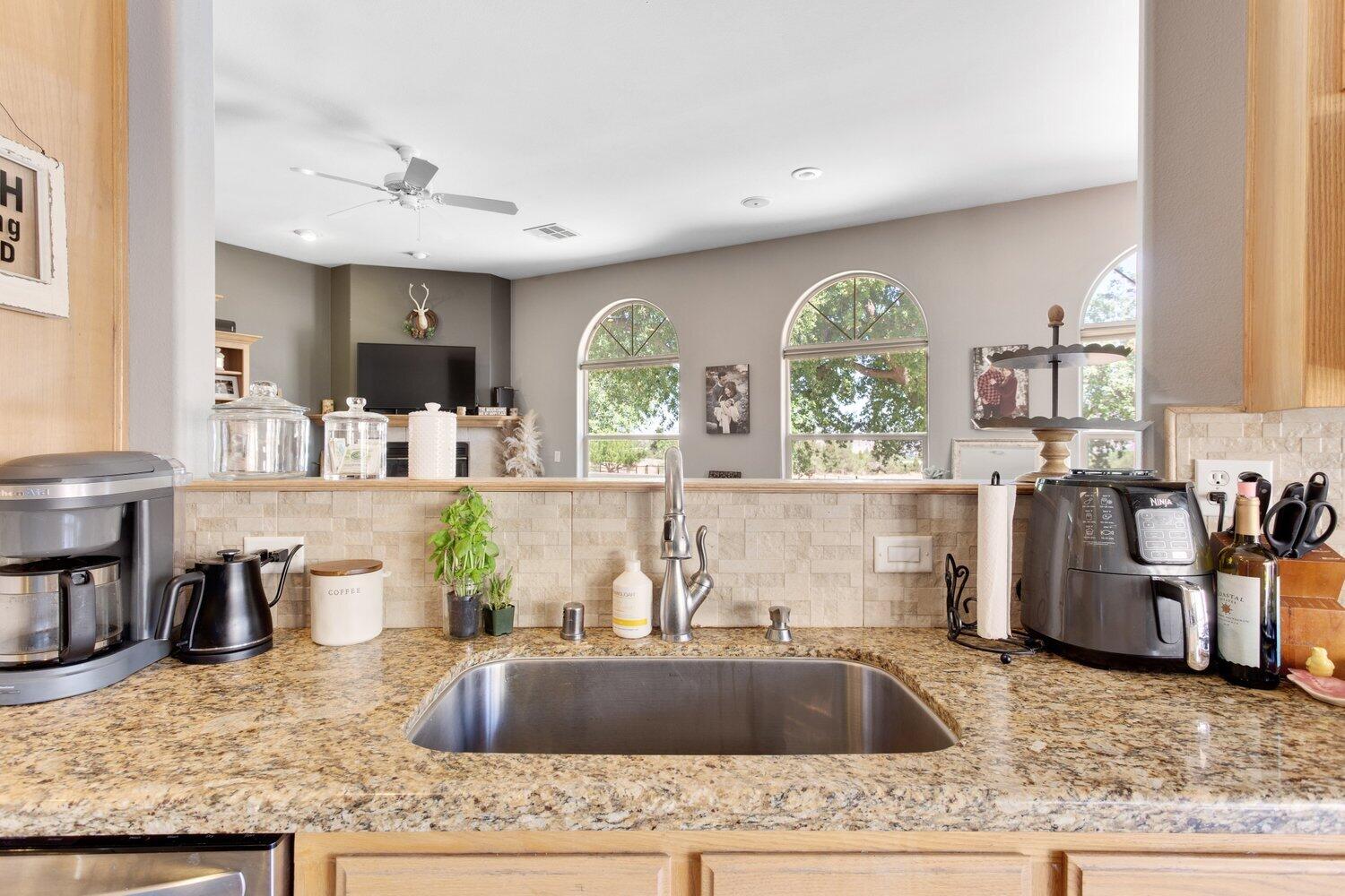19510 Banducci Road Tehachapi, CA 93561 - Photo 23 of 75 a kitchen with large window a sink and living room view