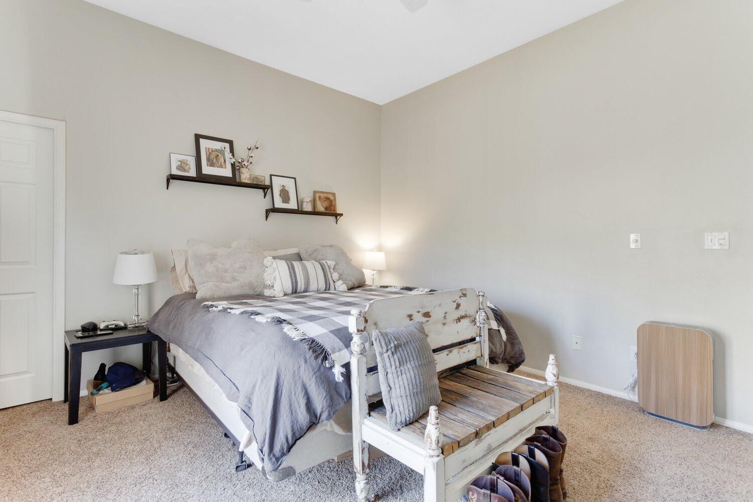 19510 Banducci Road Tehachapi, CA 93561 - Photo 28 of 75 a bed sitting in a bedroom and night stand