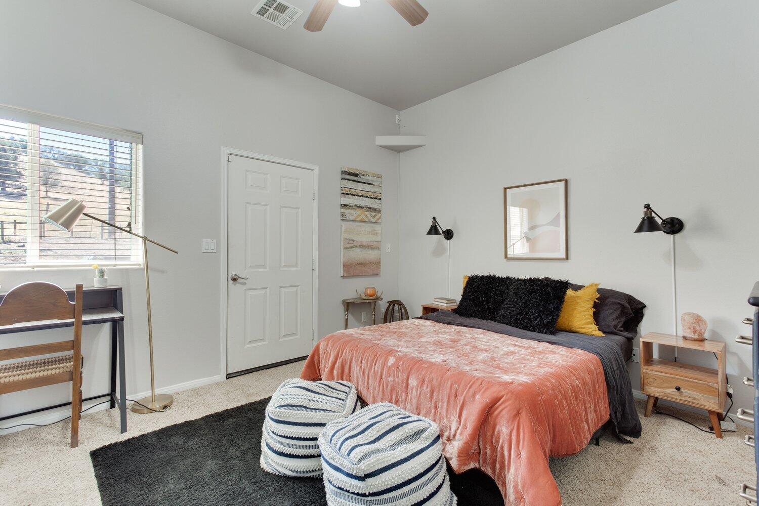 19510 Banducci Road Tehachapi, CA 93561 - Photo 31 of 75 a bedroom with a bed and wooden floor