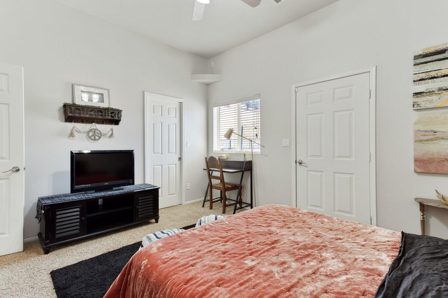 19510 Banducci Road Tehachapi, CA 93561 - Photo 32 of 75 a bedroom with a bed and a flat screen tv