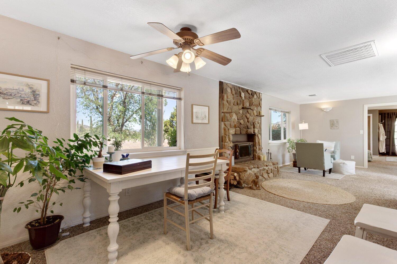 19510 Banducci Road Tehachapi, CA 93561 - Photo 48 of 75 a living room with furniture a chandelier and a large window