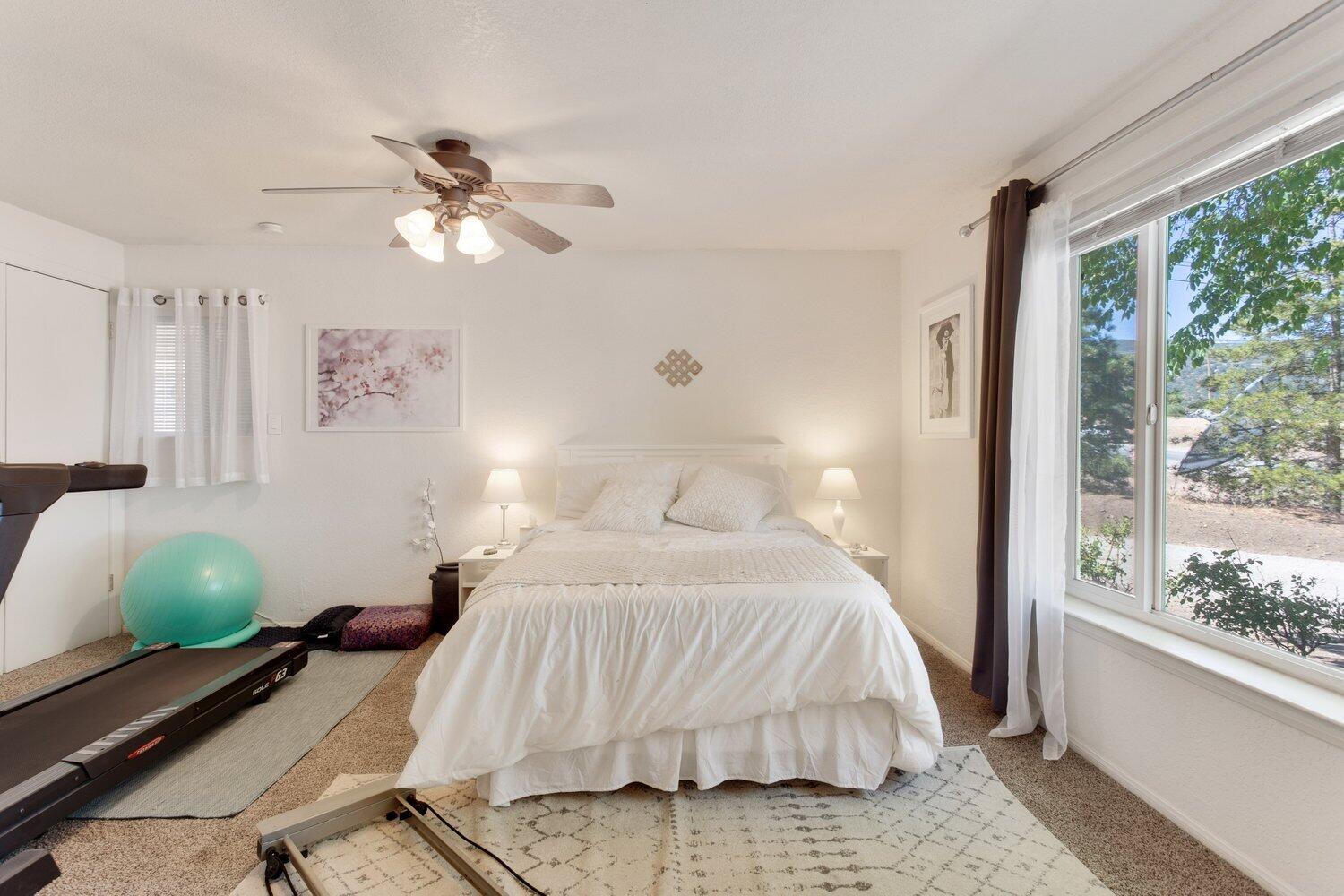 19510 Banducci Road Tehachapi, CA 93561 - Photo 68 of 75 a bedroom with a bed and window