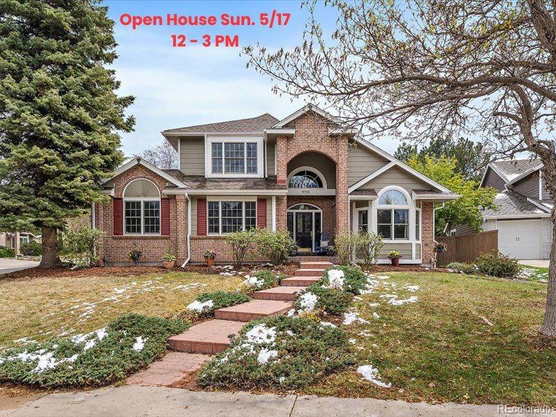 9306 Sulton Court Highlands Ranch, CO 80126 - Photo 1 of 48 a front view of a house with a yard