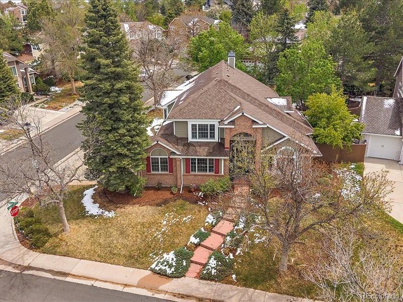 9306 Sulton Court Highlands Ranch, CO 80126 - Photo 2 of 48 front view of a house with a yard