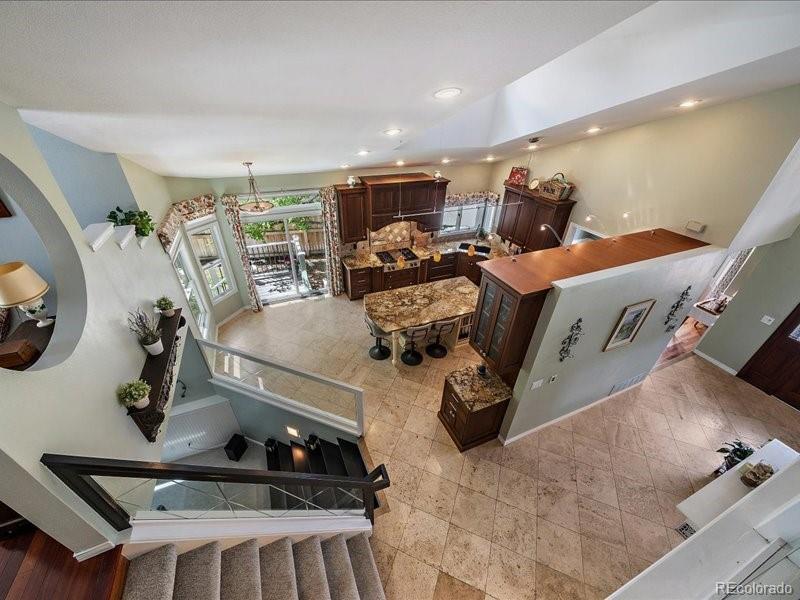 9306 Sulton Court Highlands Ranch, CO 80126 - Photo 25 of 48 a room with gym equipment and a view of living room