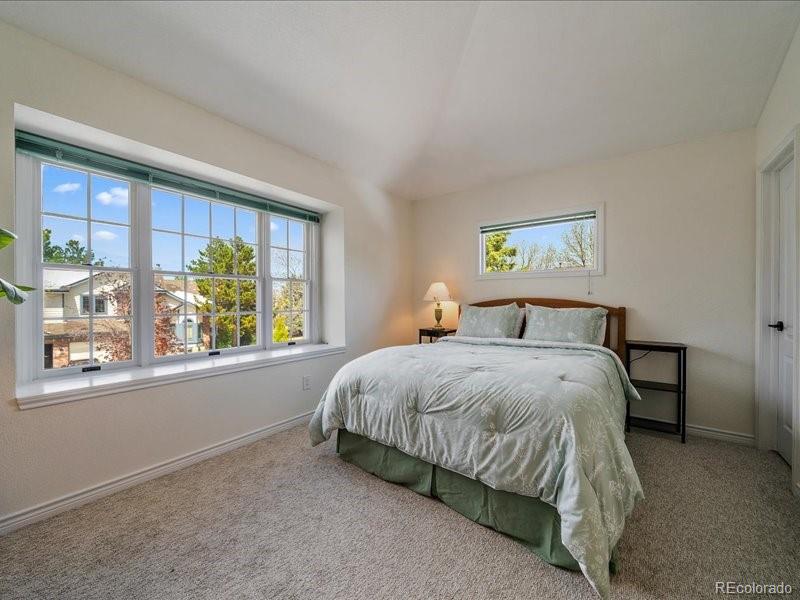 9306 Sulton Court Highlands Ranch, CO 80126 - Photo 26 of 48 a bedroom with a bed and window