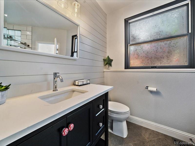 9306 Sulton Court Highlands Ranch, CO 80126 - Photo 32 of 48 a bathroom with a sink and a mirror