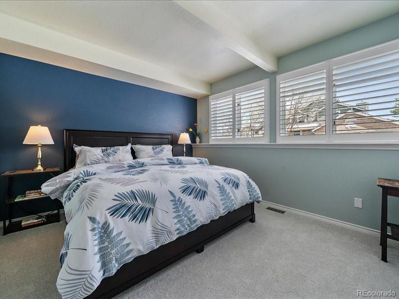 9306 Sulton Court Highlands Ranch, CO 80126 - Photo 34 of 48 a bedroom with a bed and window