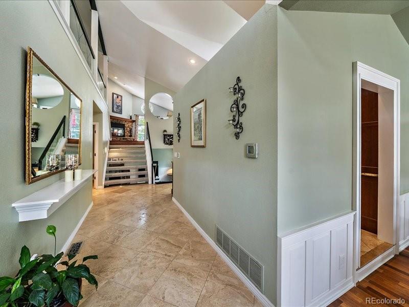 9306 Sulton Court Highlands Ranch, CO 80126 - Photo 4 of 48 a view of a hallway with entryway