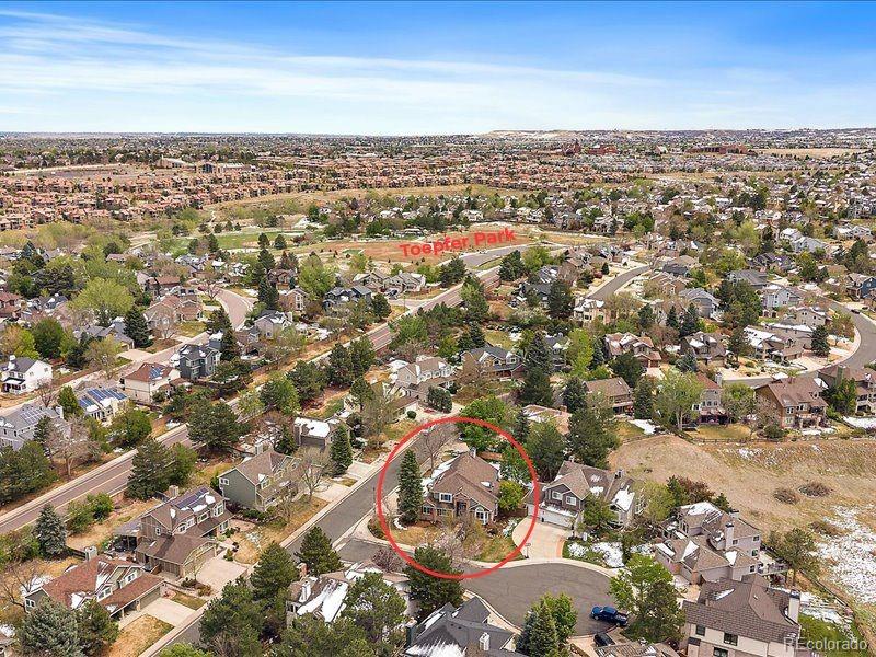 9306 Sulton Court Highlands Ranch, CO 80126 - Photo 46 of 48 an aerial view of residential building with green space