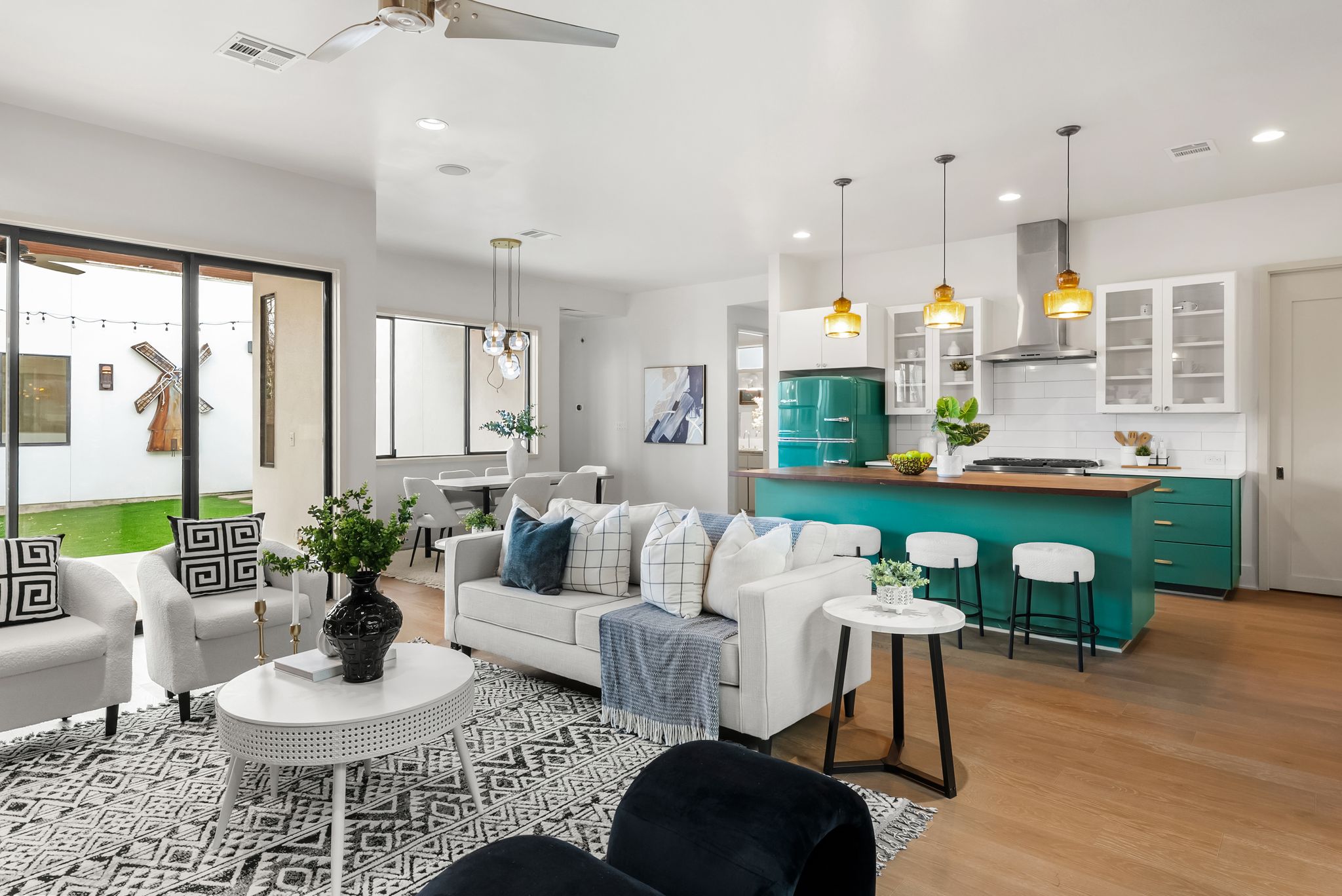 513 El Paso Street Austin, TX 78704 - Photo 12 of 34 a living room with furniture kitchen and a chandelier