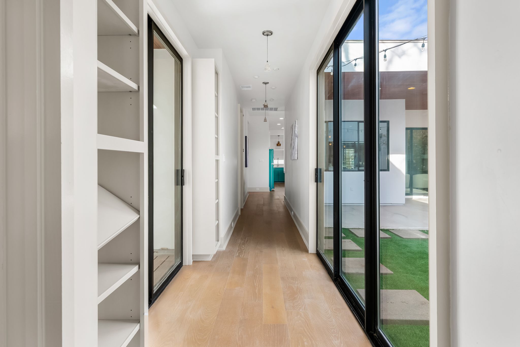 513 El Paso Street Austin, TX 78704 - Photo 19 of 34 a view of a hallway with wooden floor and entryway