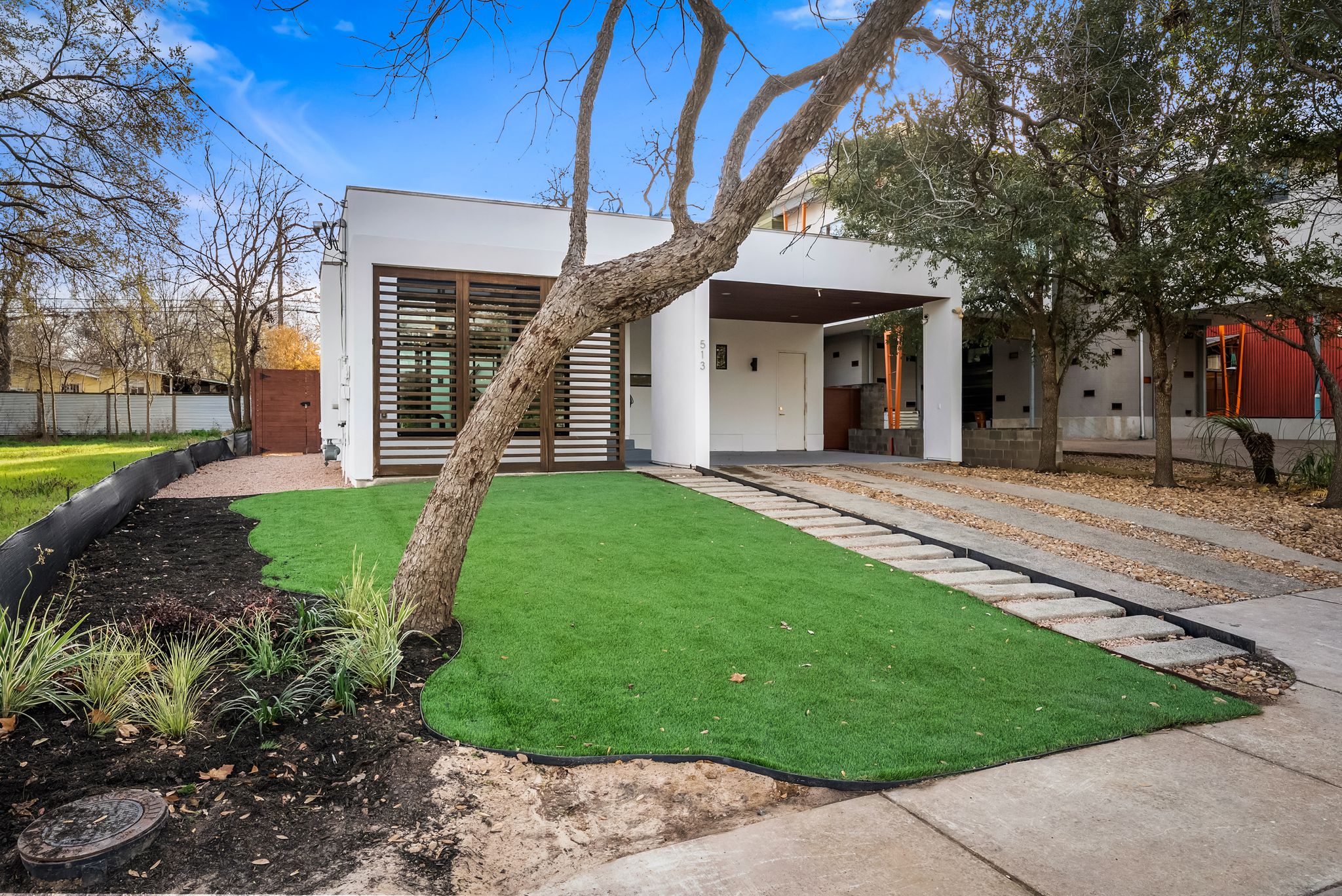 513 El Paso Street Austin, TX 78704 - Photo 3 of 34 a front view of a house with a yard