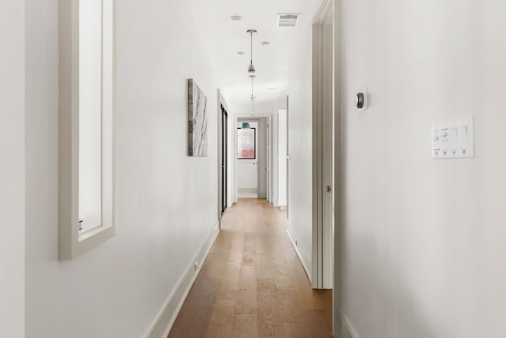 513 El Paso Street Austin, TX 78704 - Photo 5 of 34 a view of a hallway with wooden floor