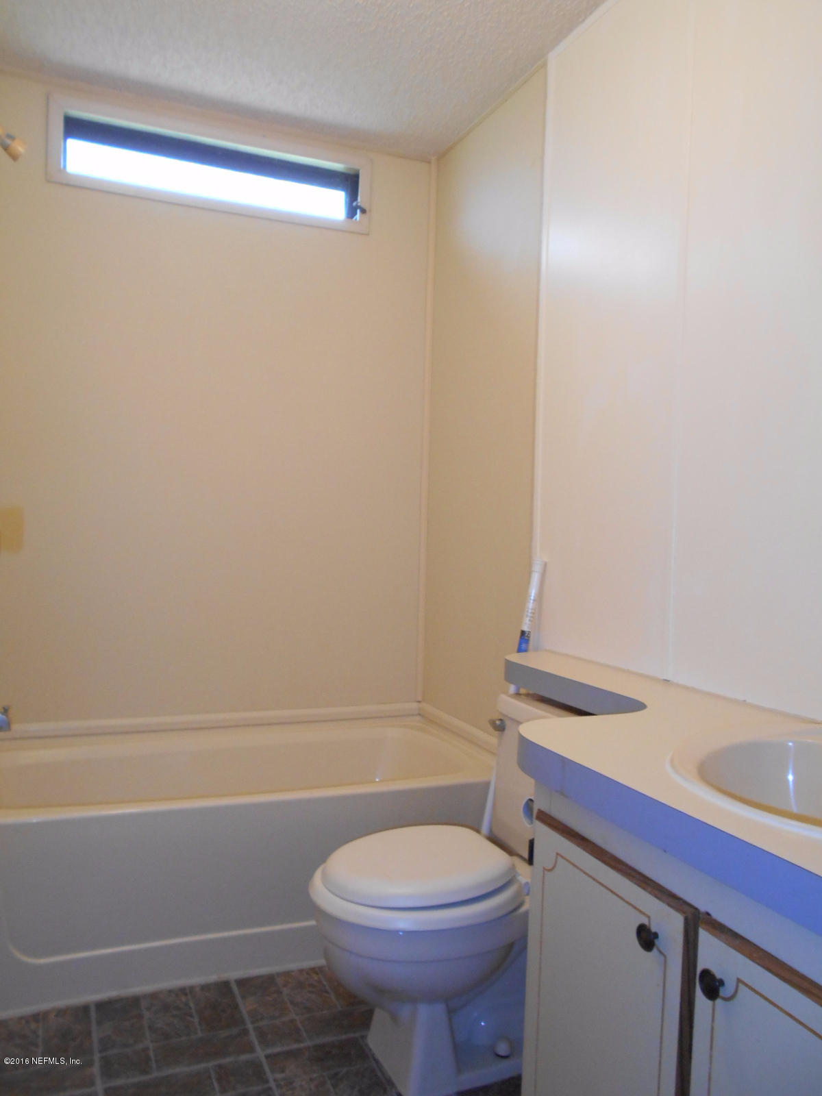 75179 Randy Road Yulee, FL 32097 - Photo 17 of 56 a bathroom with a sink a toilet and shower
