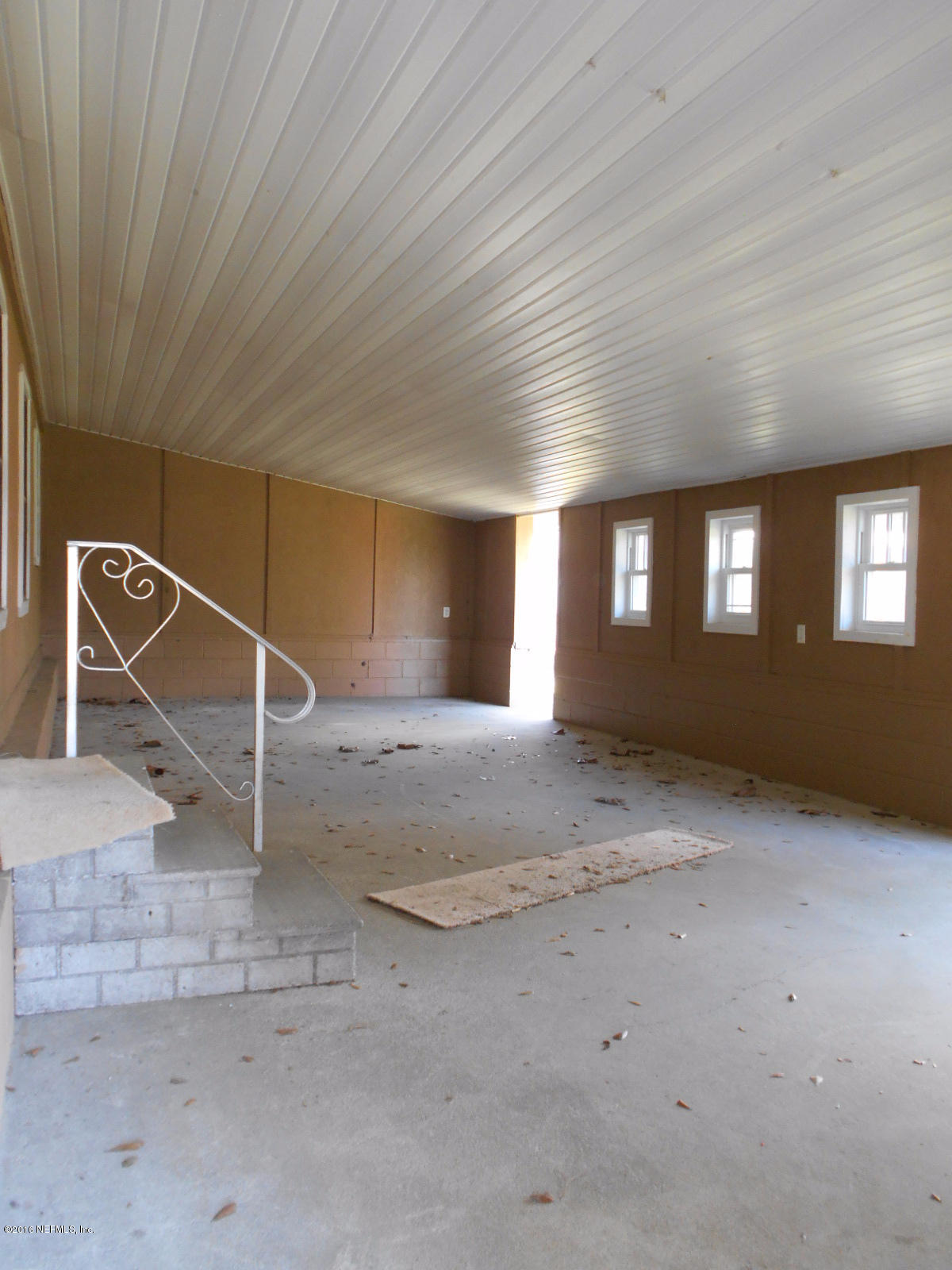 75179 Randy Road Yulee, FL 32097 - Photo 8 of 56 a view of an empty room with windows