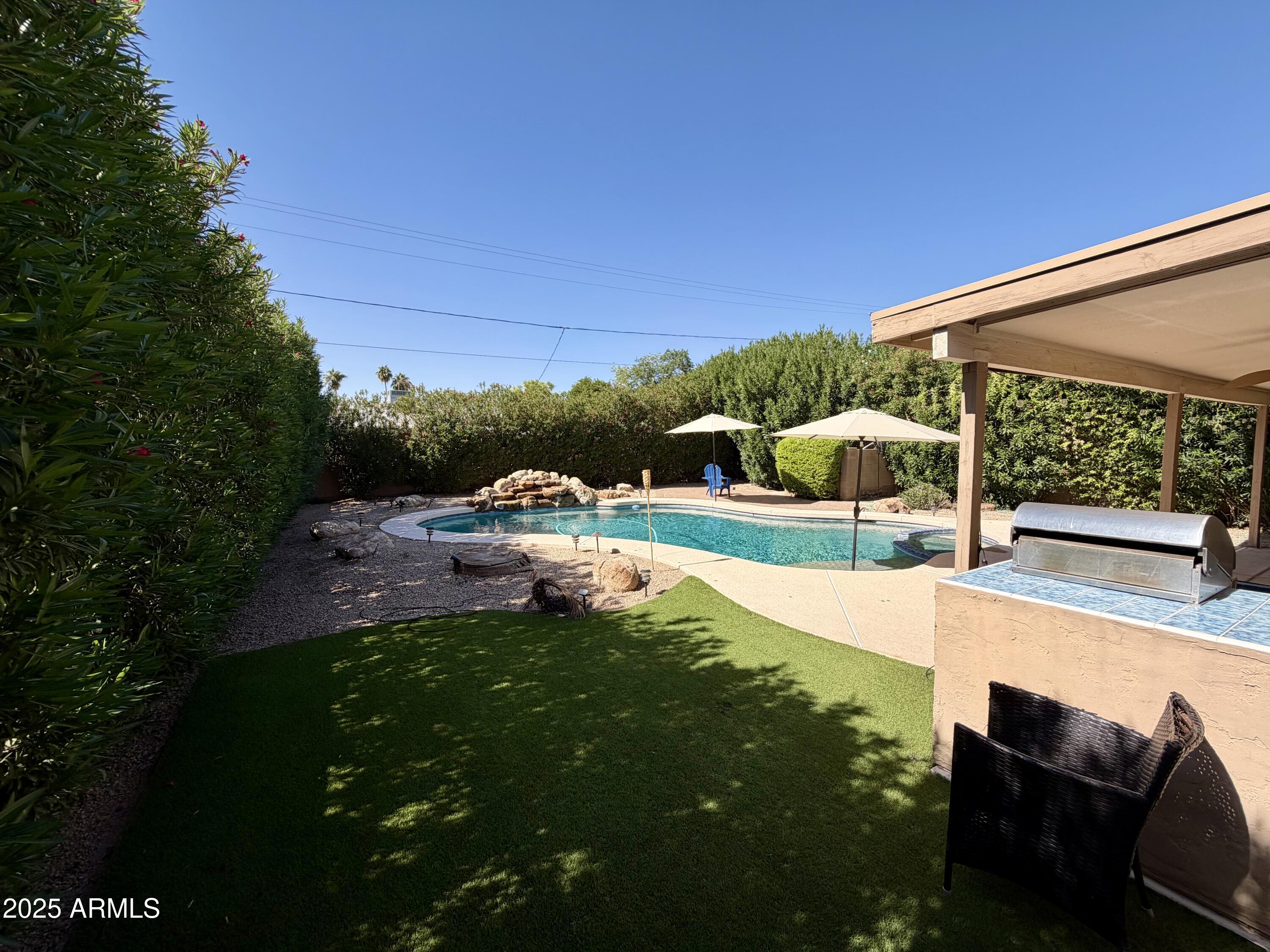 3068 North 83rd Place Scottsdale, AZ 85251 - Photo 18 of 46 a view of a backyard with sitting area