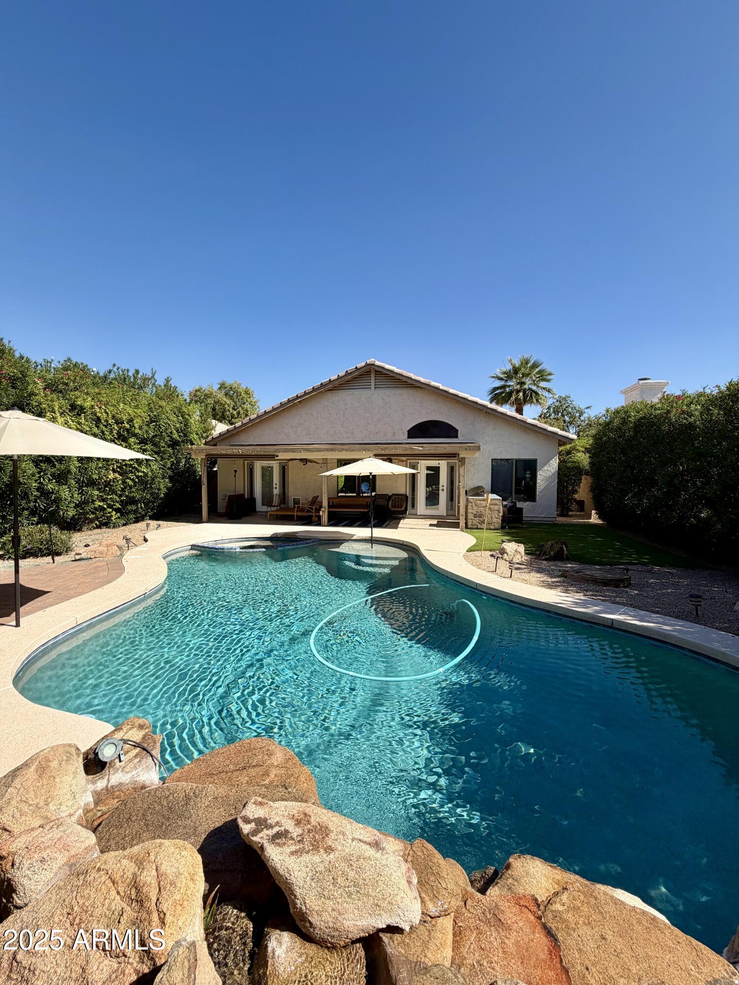 3068 North 83rd Place Scottsdale, AZ 85251 - Photo 2 of 46 a front view of a house with garden