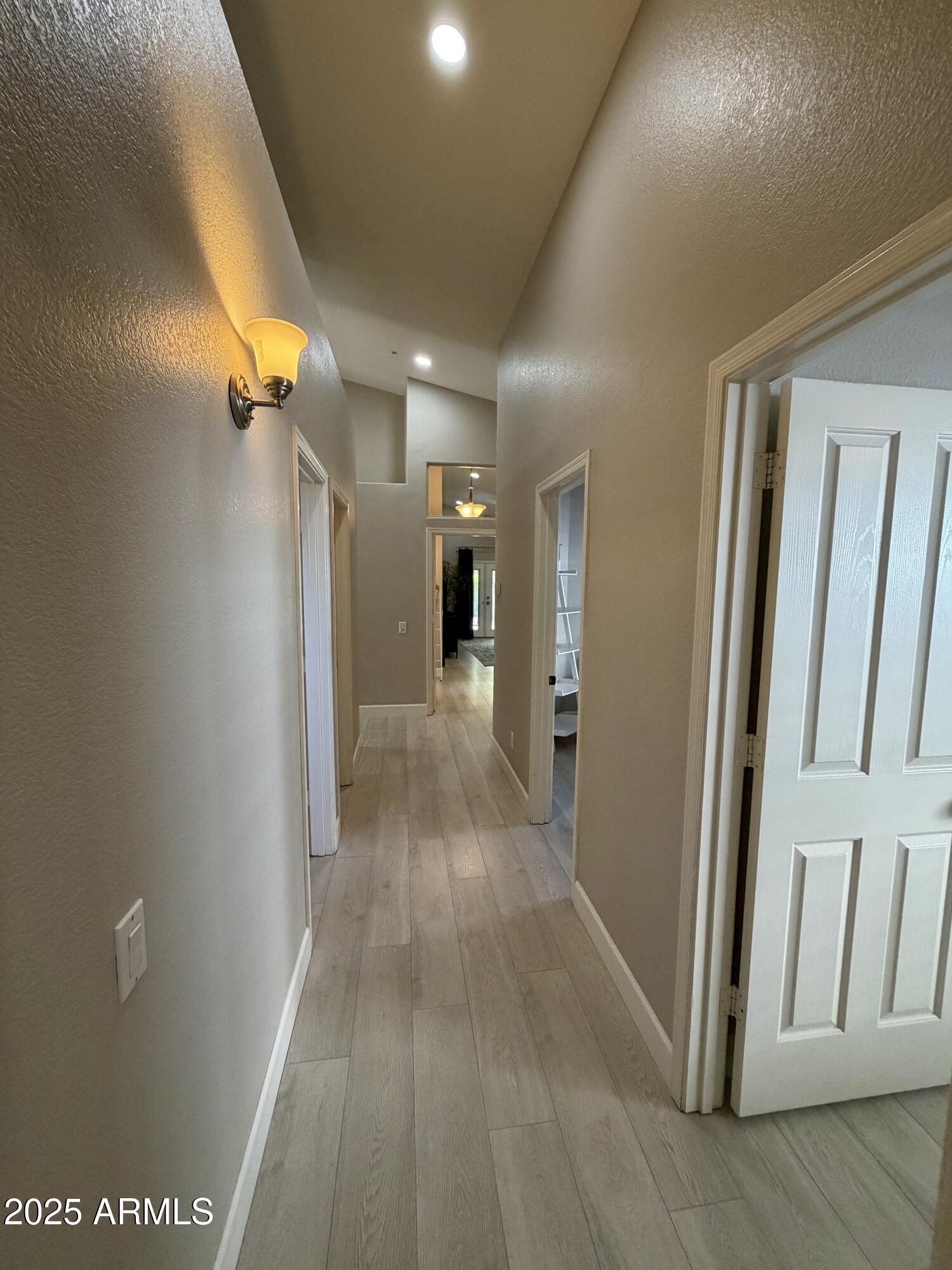 3068 North 83rd Place Scottsdale, AZ 85251 - Photo 23 of 46 a view of a hallway with wooden floor