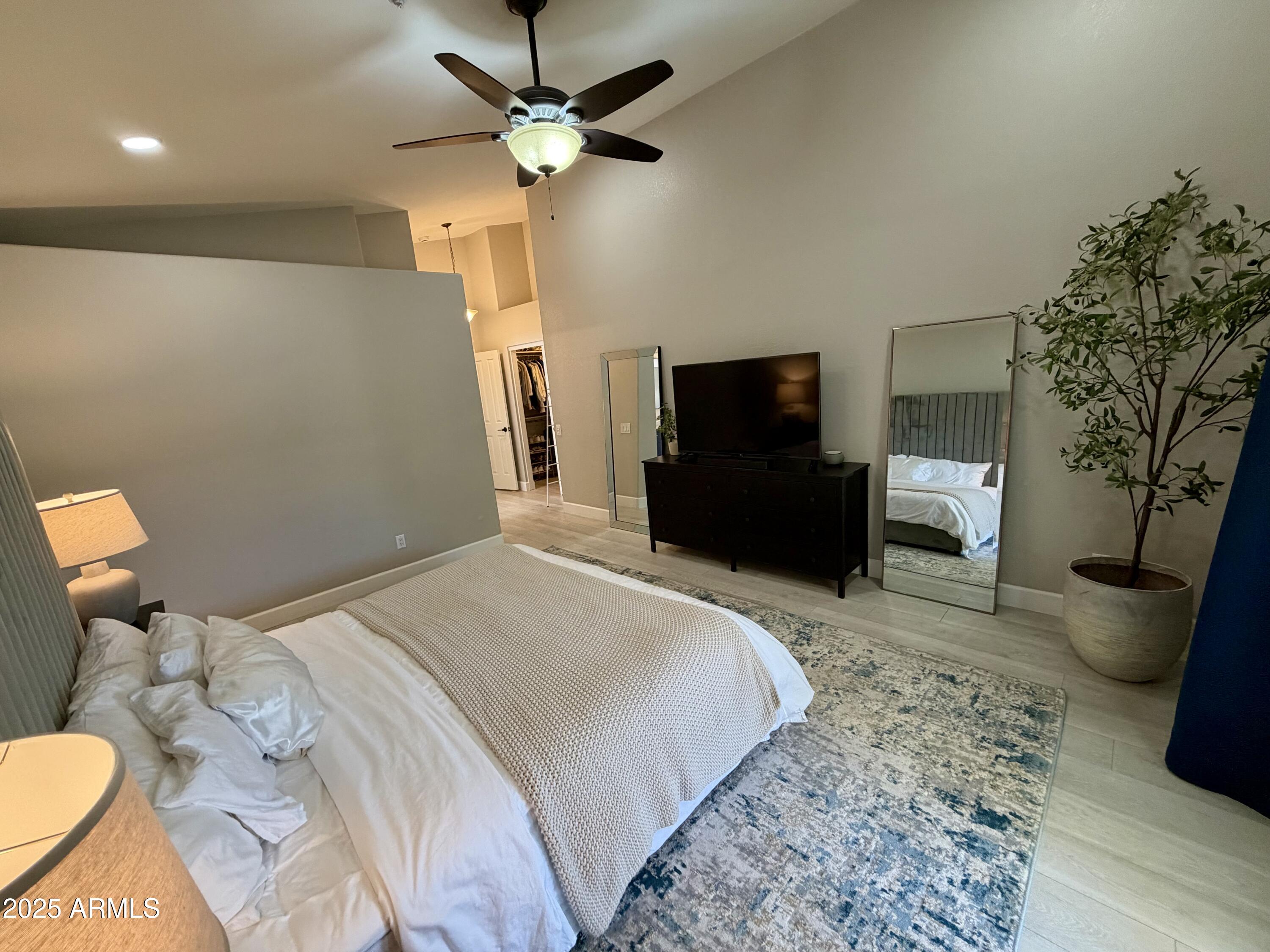 3068 North 83rd Place Scottsdale, AZ 85251 - Photo 31 of 46 a bedroom with a bed and a television