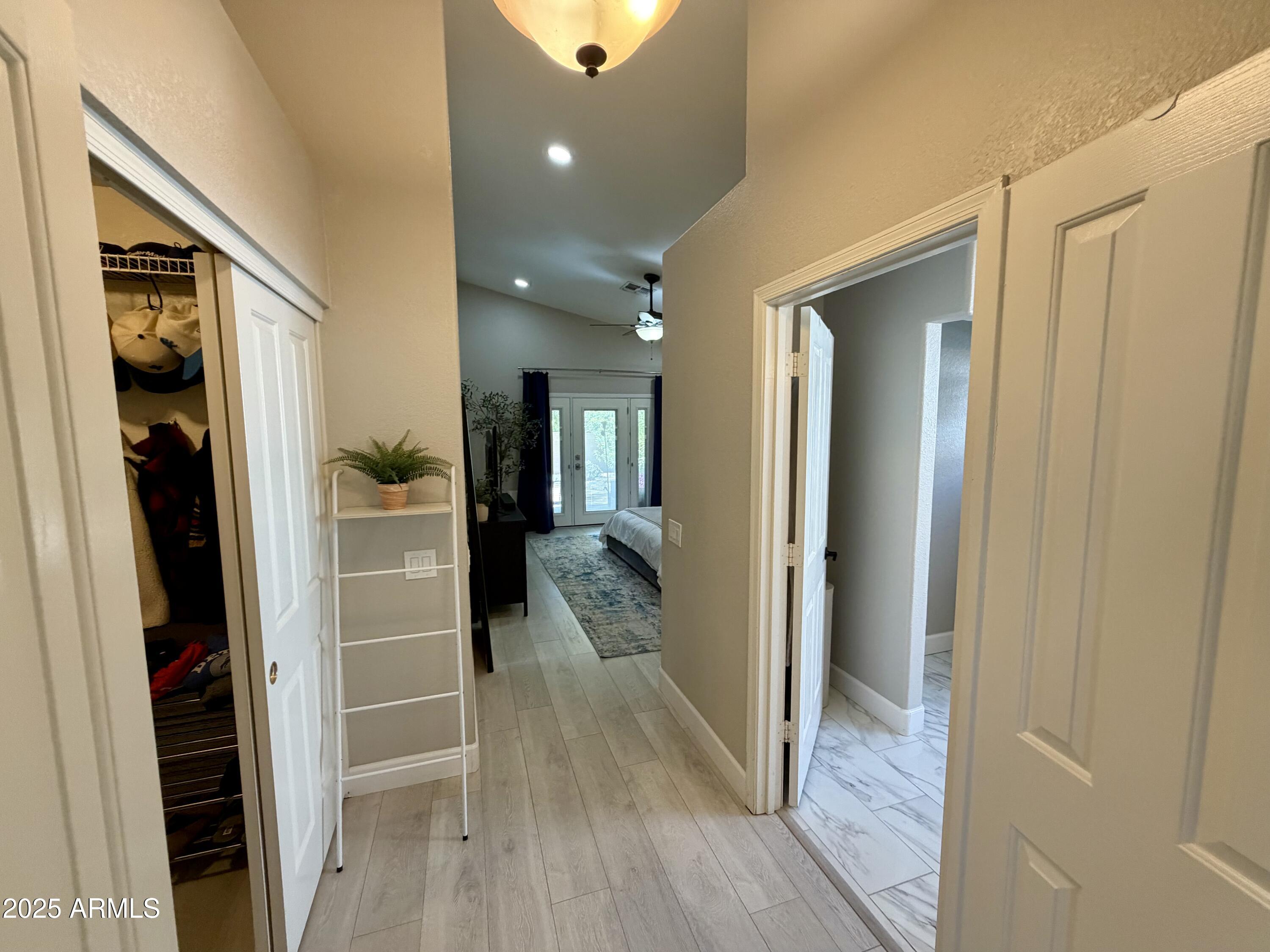 3068 North 83rd Place Scottsdale, AZ 85251 - Photo 33 of 46 a view of a hallway with wooden floor and closet area