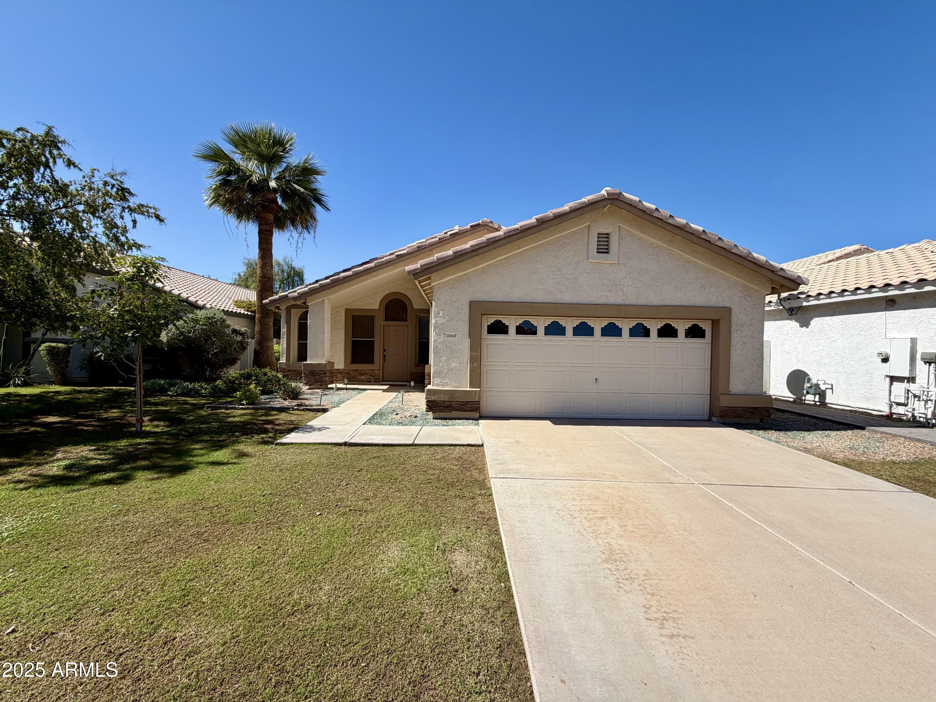 3068 North 83rd Place Scottsdale, AZ 85251 - Photo 4 of 46 a front view of a house with a yard