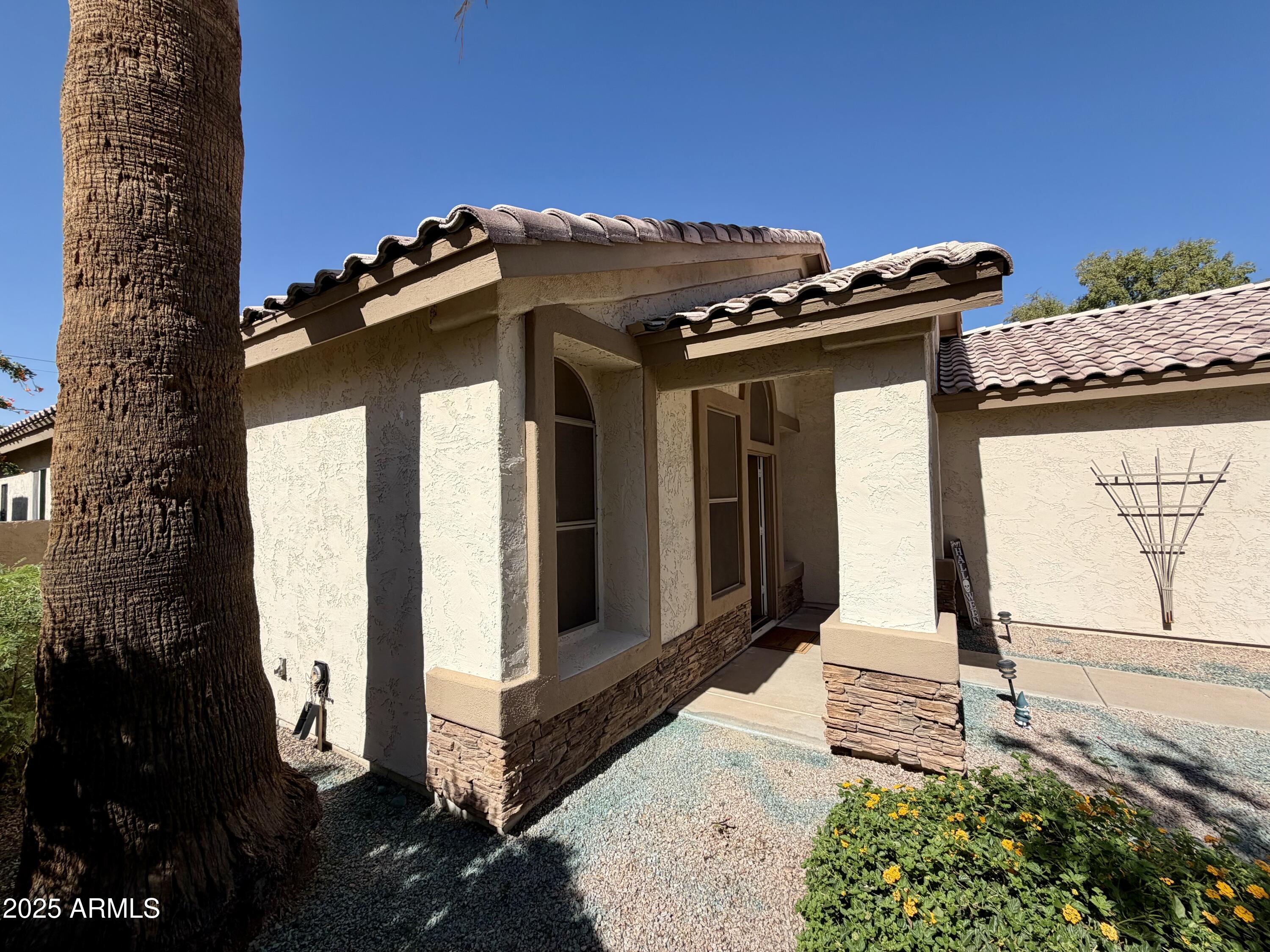 3068 North 83rd Place Scottsdale, AZ 85251 - Photo 6 of 46 a view of a house with a small yard