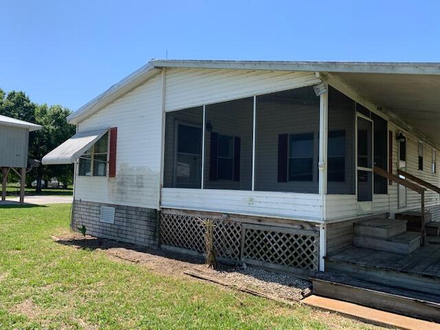 1309 Chobee Loop Okeechobee, FL 34974 - Photo 3 of 16 Side