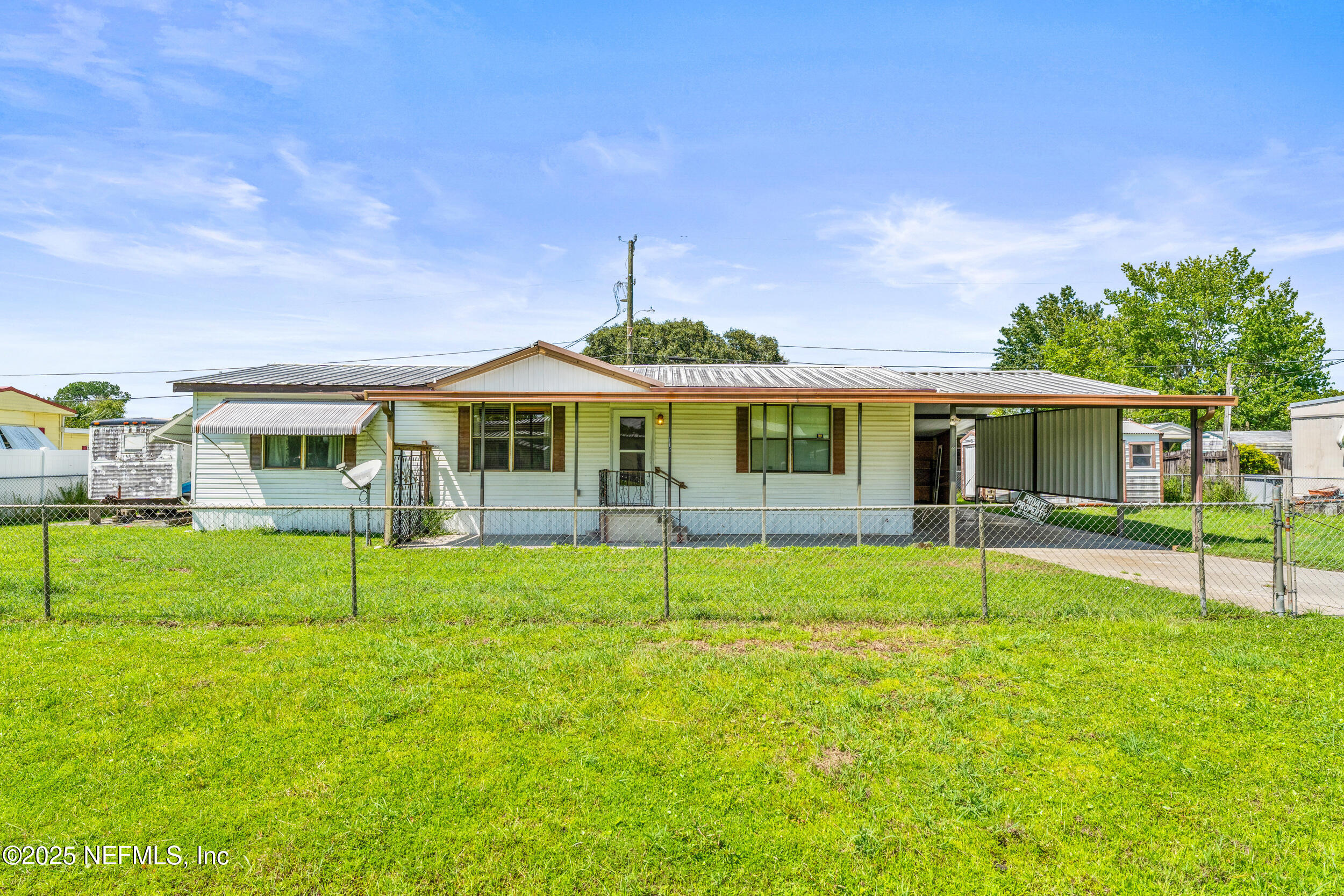 a house that has a big yard in front of it