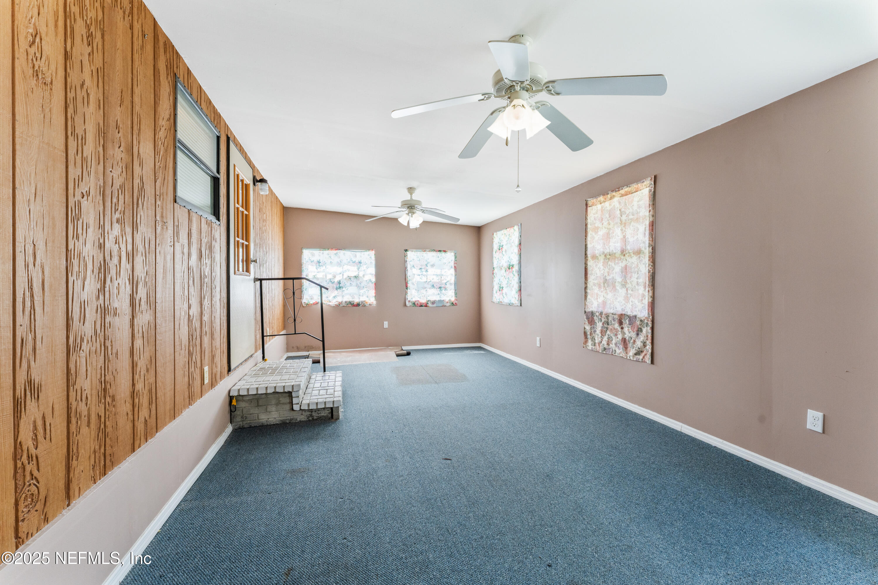 116 Iowa Street Crescent City, FL 32112 - Photo 19 of 25 a view of livingroom with hardwood floor and window