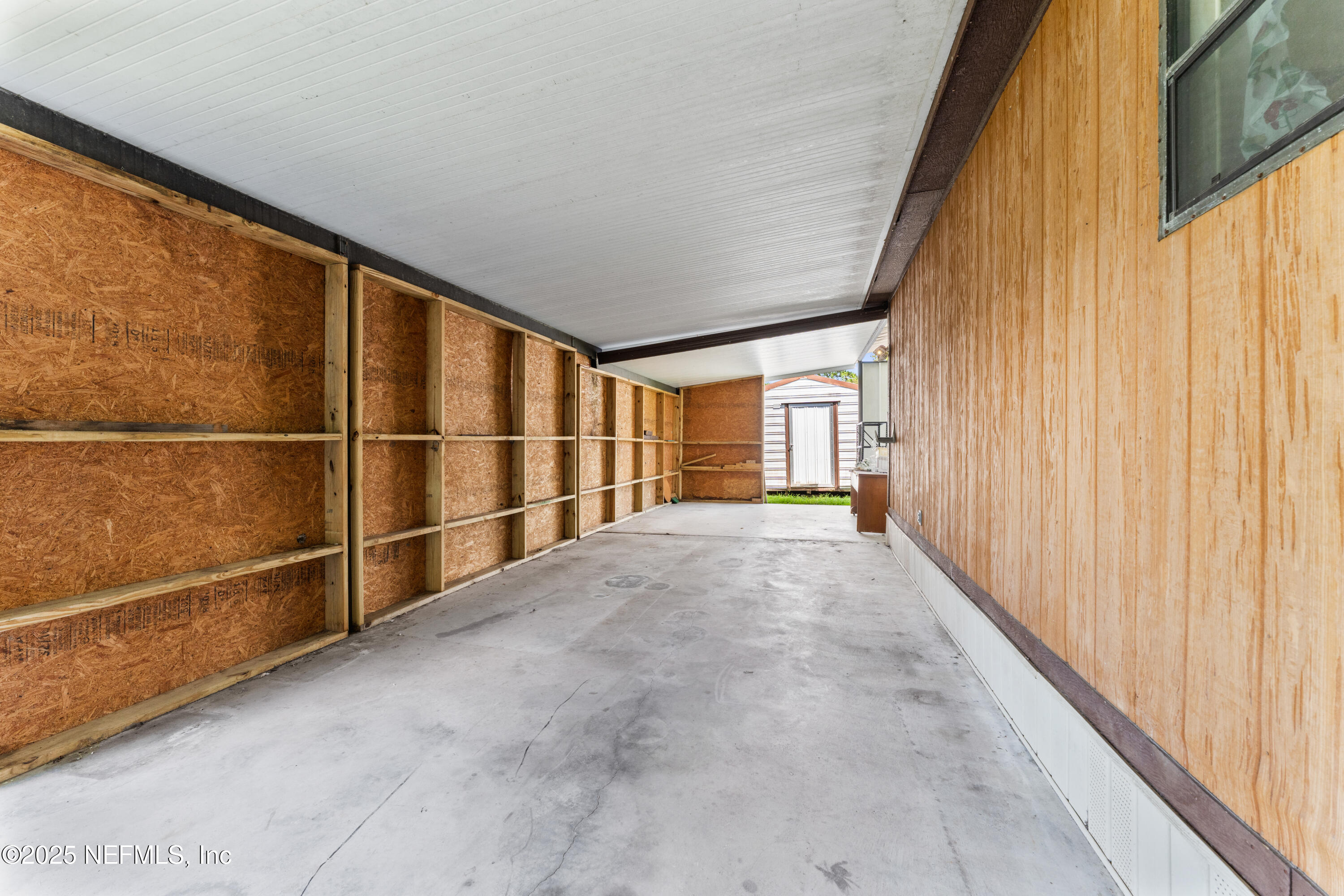 116 Iowa Street Crescent City, FL 32112 - Photo 20 of 25 a view of an empty room with a window