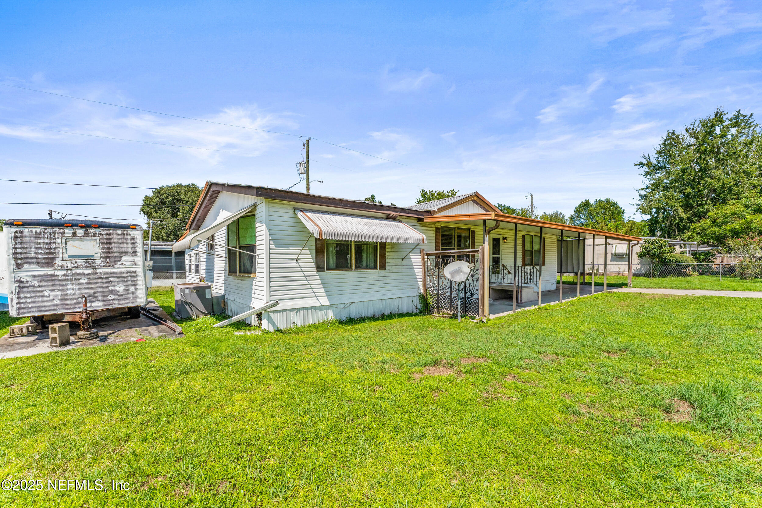 116 Iowa Street Crescent City, FL 32112 - Photo 2 of 25 a front view of house with yard and green space