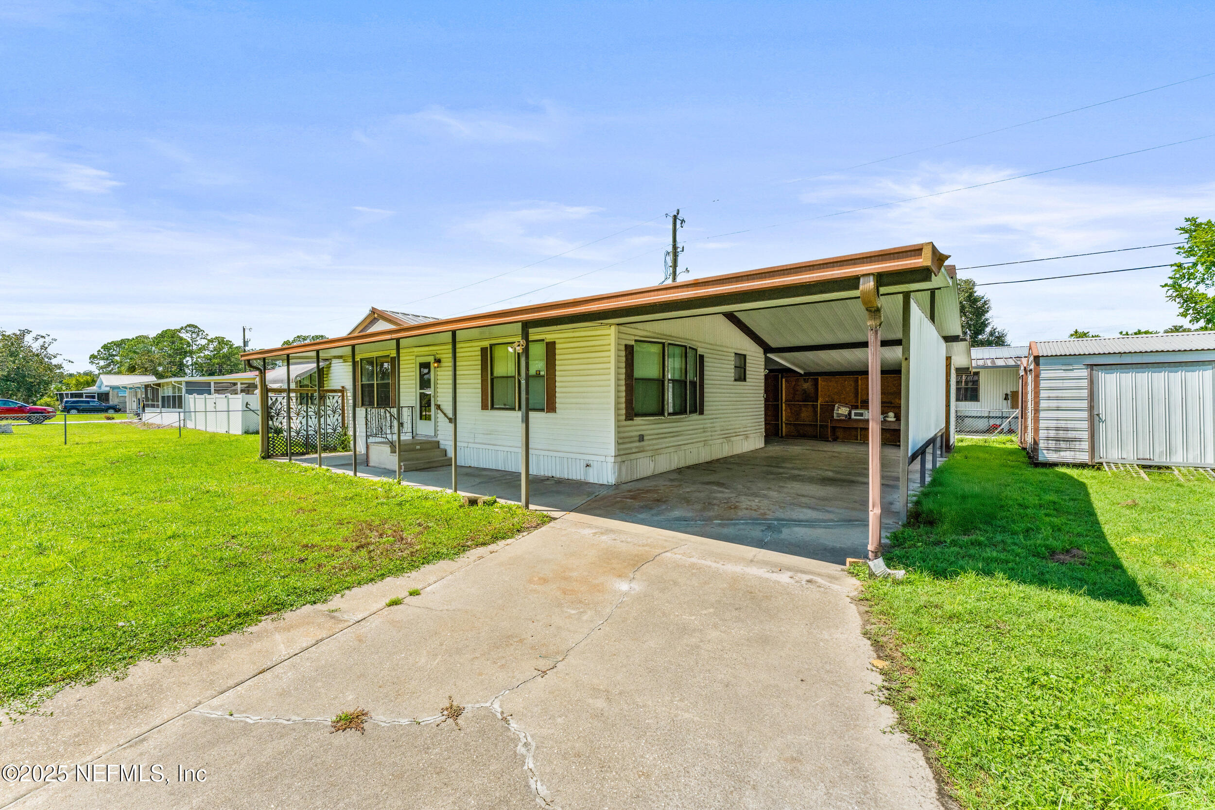 116 Iowa Street Crescent City, FL 32112 - Photo 23 of 25 a view of a house with backyard and garden