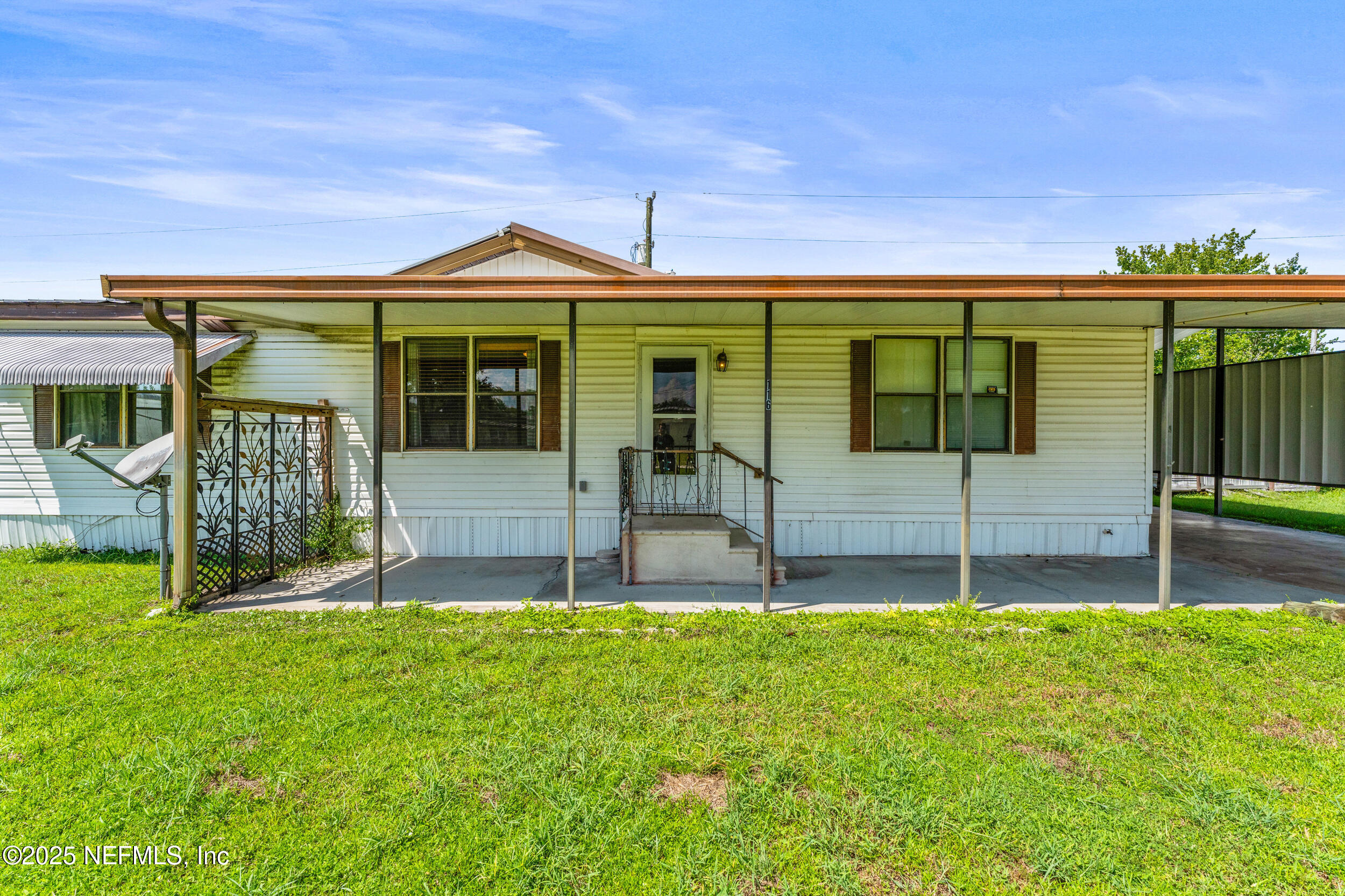 116 Iowa Street Crescent City, FL 32112 - Photo 3 of 25 a view of a house with a garden