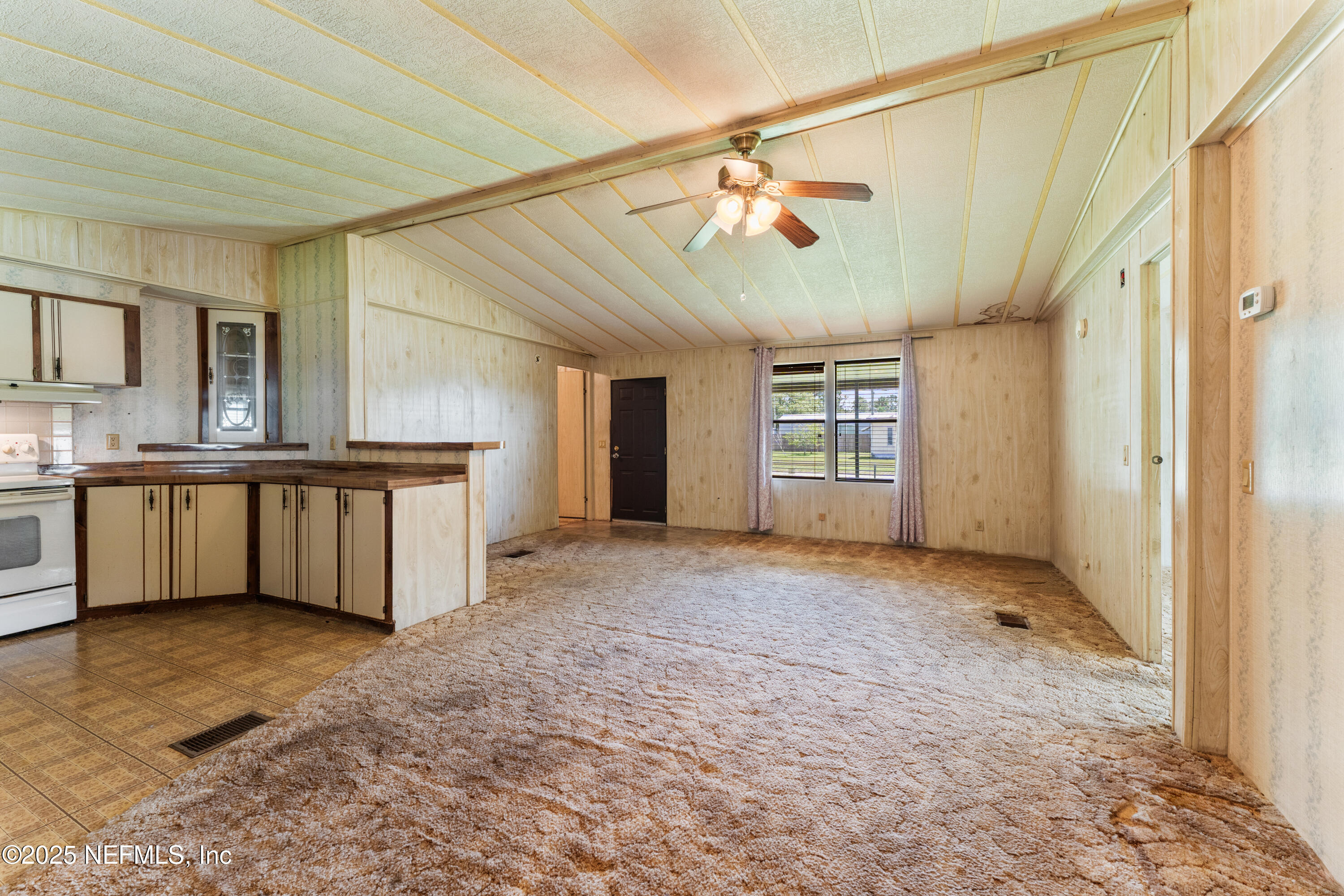 116 Iowa Street Crescent City, FL 32112 - Photo 4 of 25 a view of a kitchen with a sink and cabinet area