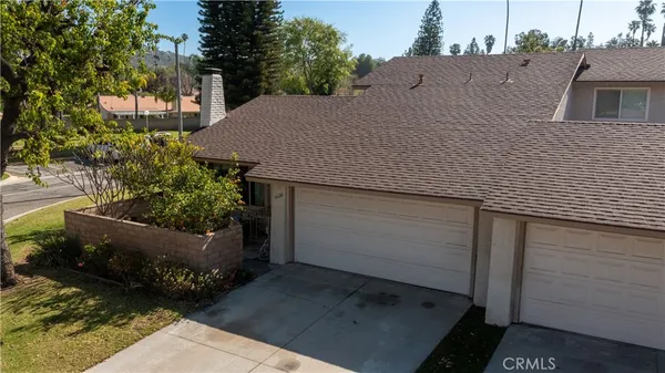 a aerial view of a house with a yard