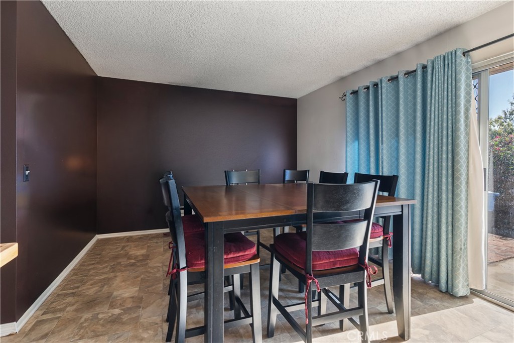 6624 Banyan Place Riverside, CA 92506 - Photo 12 of 41 a view of a dining room with furniture and window