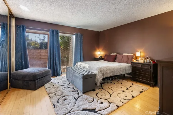 a bedroom with double bed and a window