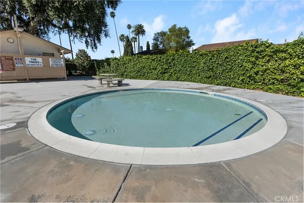 a view of a swimming pool with a yard