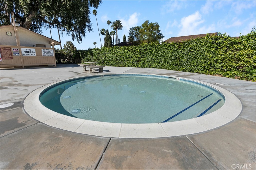 6624 Banyan Place Riverside, CA 92506 - Photo 30 of 41 a view of a swimming pool with a yard