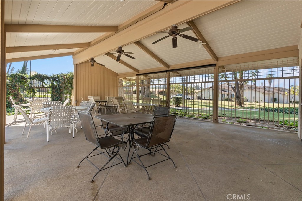 6624 Banyan Place Riverside, CA 92506 - Photo 31 of 41 a dining room with furniture and a floor to ceiling window